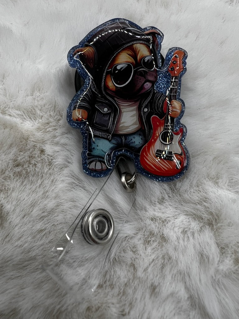 Badge holder with a cool bulldog playing guitar design on a fluffy white background