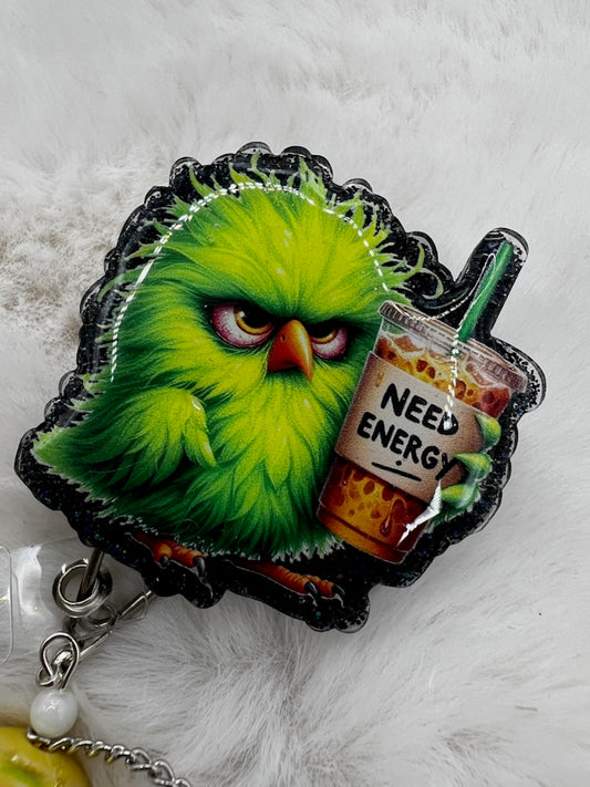 Green bird character holding a 'Need Energy' drink on a white background