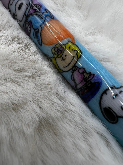 Peanuts cartoon character pen on a fluffy white surface