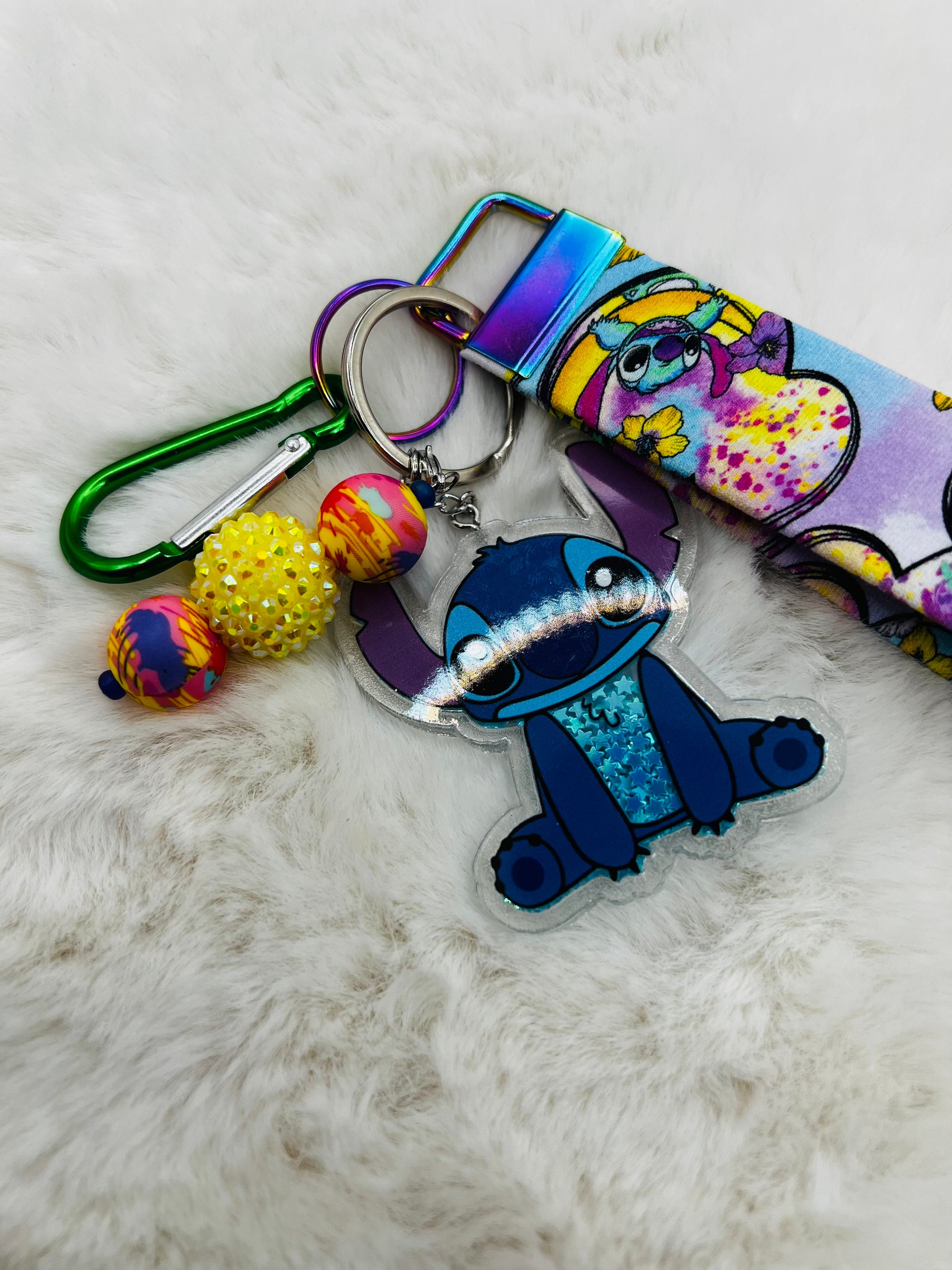 Colorful keychain with cartoon character Stitch, on a textured surface