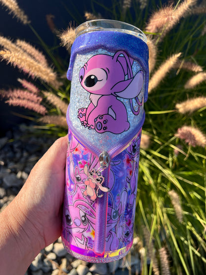 Hand holding a purple glittery tumbler with cartoon character Angel of Lilo & Stitch design against a natural background