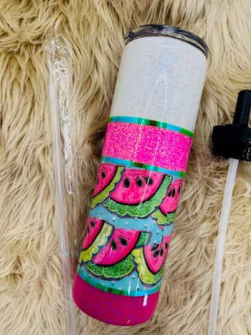 Tumbler with watermelon pattern on a fluffy beige surface