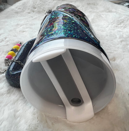 Colorful glittery tumbler with Betty Boop character design on a white fluffy surface