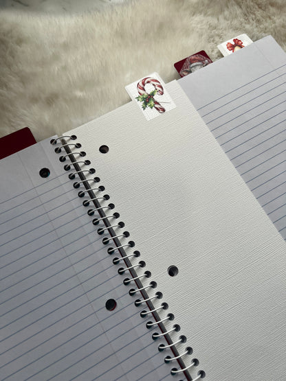 Gray notebook with spiral binding on a textured surface