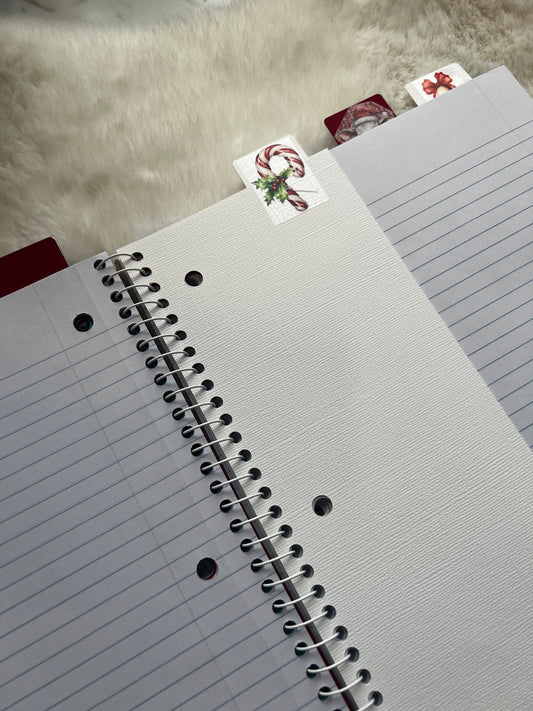 Gray notebook with spiral binding on a textured surface