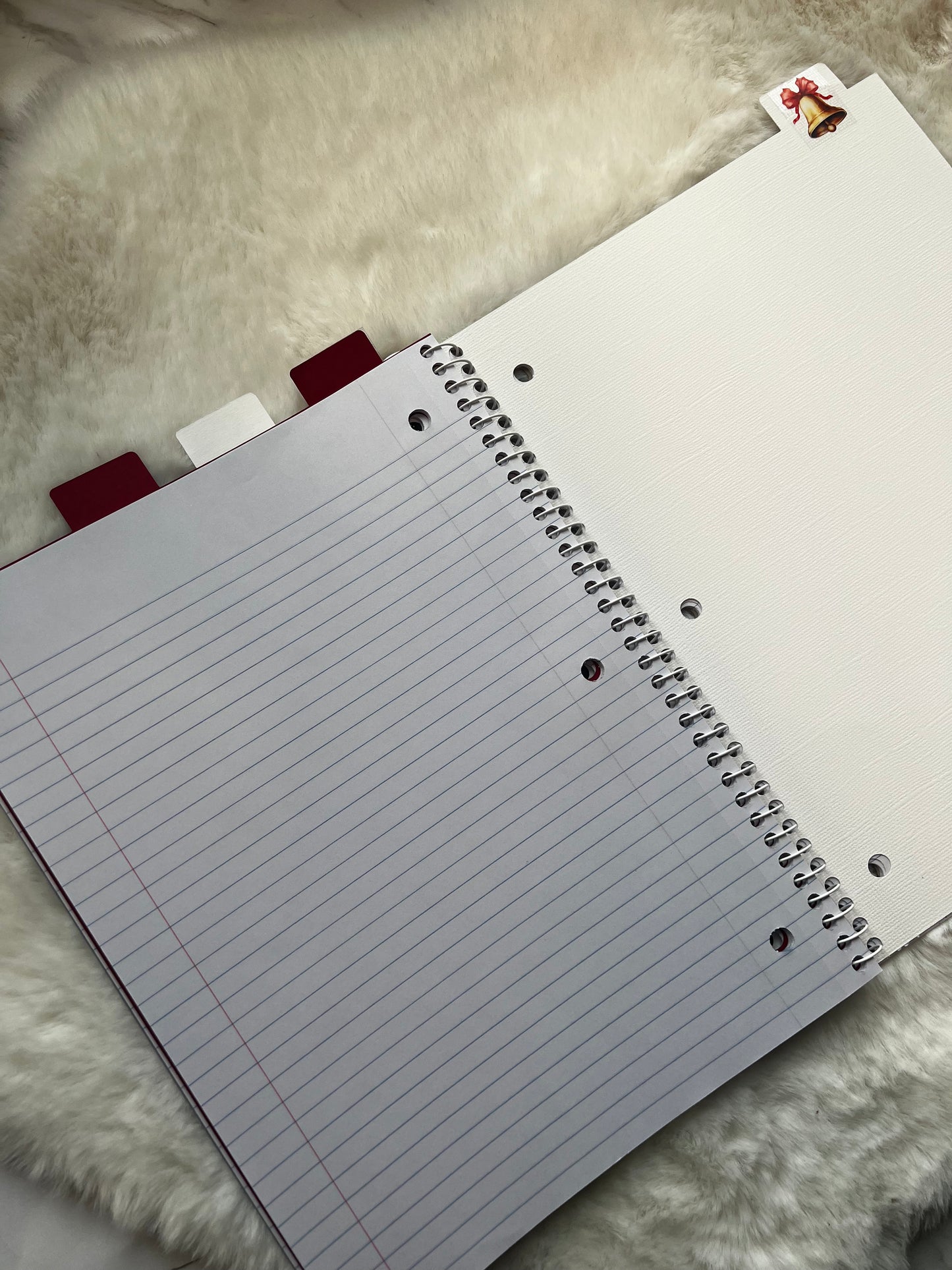 Notebook with lined pages on a textured surface