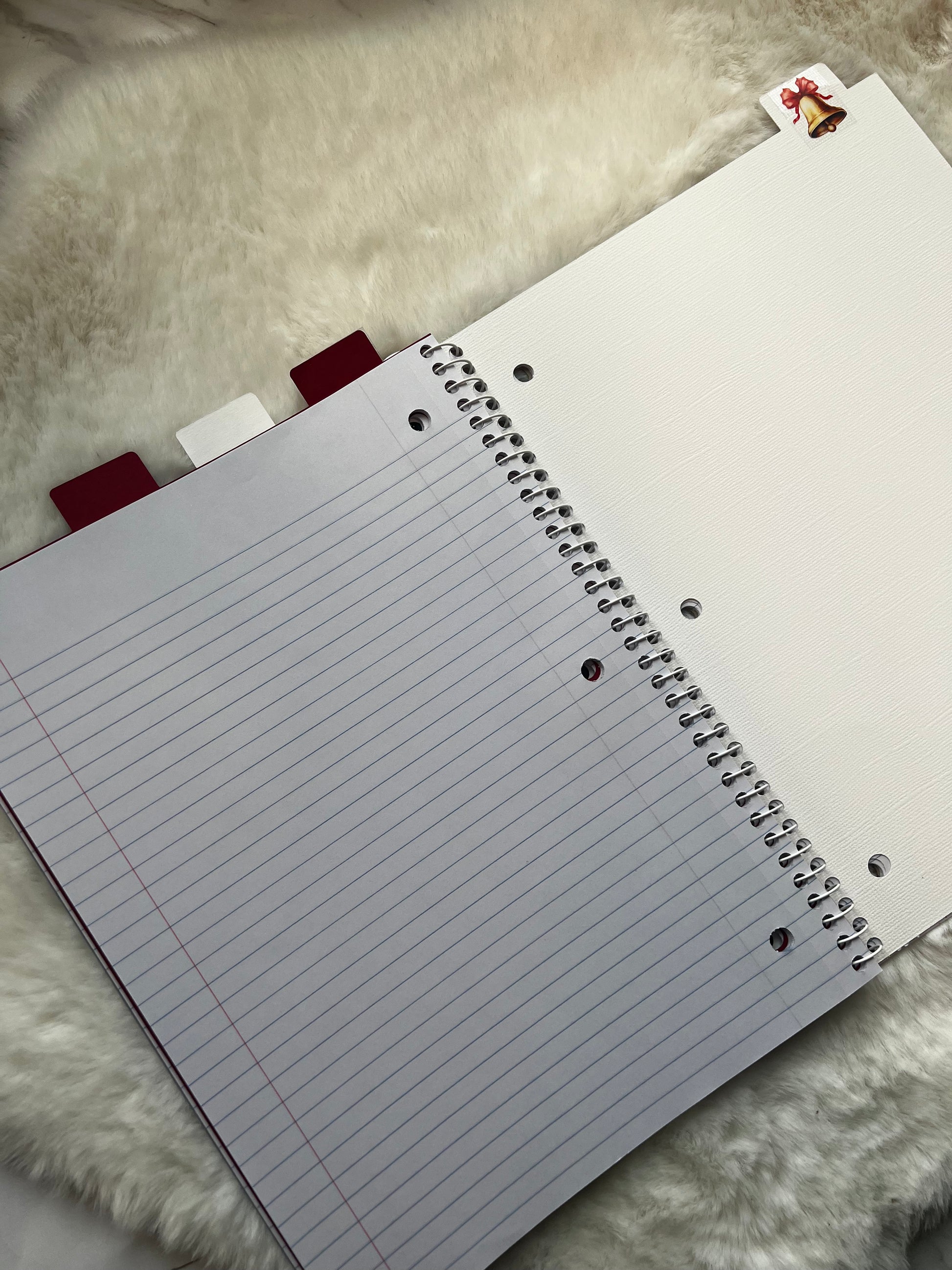 Notebook with lined pages on a textured surface
