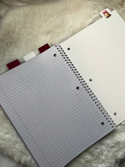 Notebook with lined pages on a textured surface